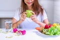 Women hands holding green apple with fruits, vegetables, water, dumbbell and tape measure on white table background. Selection of Royalty Free Stock Photo