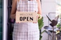 Woman hands holding open sign after lockdown,Small business plants shop owner,Reopening Royalty Free Stock Photo