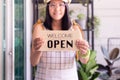 Woman hands holding open sign after lockdown,Small business plants shop owner,Reopening Royalty Free Stock Photo