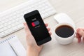 Women hands holding phone with low charged battery on screen Royalty Free Stock Photo