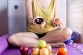 Woman hands holding red apple and baked chocolate donut at home,Healthy diet,Dieting concept Royalty Free Stock Photo