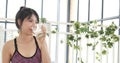 Women hands holding white glass of milk pouring from bottle. Asian women smile laugh look at camera health care home fitness Royalty Free Stock Photo