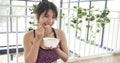 Women hands holding white glass of milk pouring from bottle. Asian women smile laugh look at camera health care home fitness Royalty Free Stock Photo