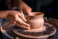 Women hands. Potter at work. Creating dishes. Potter& x27;s wheel. Dirty hands in the clay and the potter& x27;s wheel with the Royalty Free Stock Photo