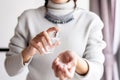 Woman hands spraying favorite perfume at home,Applying perfume is the simplest of matters