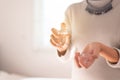 Woman hands spraying favorite perfume at home,Applying perfume is the simplest of matters