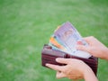 Women Hands taking out money malaysia ringgit from wallet Royalty Free Stock Photo