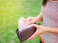 Women Hands taking out money thai baht from wallet Royalty Free Stock Photo