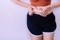 Woman hands touching cellulite on belly skin excess and overweight fat of female,Orange peel skin,Copy space for text on white bac Royalty Free Stock Photo