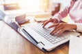 Women hands typing on the keyboard Work at home.