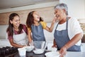 Women, happy family and bake food in kitchen smile together love cooking dessert and bonding at family home. Excited