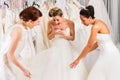 Women having fun during bridal dress fitting in shop Royalty Free Stock Photo