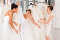 Women having fun during bridal dress fitting in shop Royalty Free Stock Photo