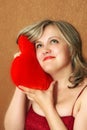 Women with a heart pillow