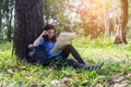 Women hiker with backpack checks map to find directions in wilderness area Royalty Free Stock Photo