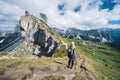 Women hiker on hiking trail path and epic landscape of Seceda peak in Dolomites Alps, Odle mountain range, South Tyrol Royalty Free Stock Photo