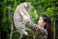 Women hold baby white bengal tiger Royalty Free Stock Photo