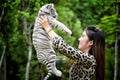 Women hold baby white bengal tiger Royalty Free Stock Photo