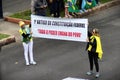 Women hold the banner written: 1st article of the federal constitution: `All power emanates from the people`