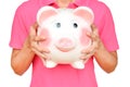 Women hold Pink piggy bank