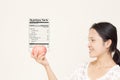 Women with apple nutrition facts label Royalty Free Stock Photo