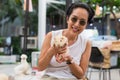 Women holding guinea pig at outdorrs garden.