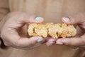 women holding a oat protein bar Royalty Free Stock Photo