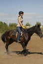 Women is horse riding, vertical Royalty Free Stock Photo