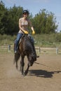 Women is horse riding, vertical shot Royalty Free Stock Photo
