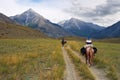 Women on horseback.