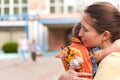 Women hugs her daughter near the school. girl does not want to leave her mother Royalty Free Stock Photo