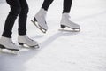 Women ice skating on ice rink