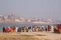 Women - Indian women wash and bathe on the opposite Bank of the Ganges from Varanasi.