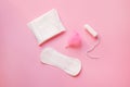 sanitary pads, menstrual cup and tampon isolated on pastel pink background, top view, flat lay Royalty Free Stock Photo