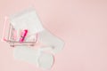 Women intimate hygiene products - sanitary pads and tampons on pink background, copy space. Menstrual period concept. Top view, Royalty Free Stock Photo