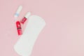 Women intimate hygiene products - sanitary pads and tampons on pink background, copy space. Menstrual period concept. Top view, Royalty Free Stock Photo