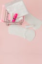 Women intimate hygiene products - sanitary pads and tampons on pink background, copy space. Menstrual period concept. Top view, Royalty Free Stock Photo