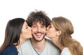 Women Kissing Man On Cheeks