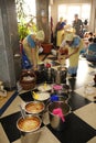 Women kitchen workers preparing to distribute Prasad for parishioners in the temple. Prasad - food that is a religious