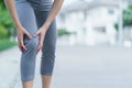 Women with knee pain. Sport exercising injury. Woman in pain while running