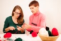 Women knitting with red wool. Eldery woman transfering her knowl Royalty Free Stock Photo