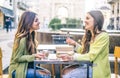 Women laughing in a bar