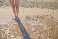 Women legs beach sand sea summer Royalty Free Stock Photo