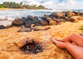 Women legs and fire on the tropical beach Royalty Free Stock Photo