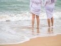 Women legs standing on the beach Royalty Free Stock Photo