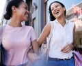 Women, lesbian couple and shopping while holding hands in city, laughing at joke and bonding. Love, sales or discount Royalty Free Stock Photo