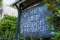 Women, Life, Freedom sign on chalkboard