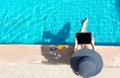 Women lifestyle play laptop relaxing near luxury swimming pool sunbath, summer day at the beach resort in the hotel.