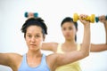 Women lifting hand weights Royalty Free Stock Photo