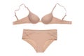 Women lingerie isolated. Close-up of beige or flesh-colored bra and panties isolated on a white background. Useful for wearing Royalty Free Stock Photo
